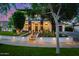 Charming home with stone accents, a well-maintained lawn, and a beautifully landscaped front yard at 20866 W Werner Pl, Buckeye, AZ 85396