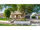 Beautiful home with a manicured lawn, stone accents, and a spacious driveway at 20866 W Werner Pl, Buckeye, AZ 85396