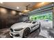 Garage featuring a luxury car with an open garage door leading to a view of the neighborhood at 20866 W Werner Pl, Buckeye, AZ 85396
