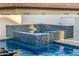 In-ground hot tub with decorative tile surround and integrated into the swimming pool design at 20866 W Werner Pl, Buckeye, AZ 85396