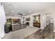 Open living room with fireplace, neutral decor, and view of hallway at 20866 W Werner Pl, Buckeye, AZ 85396