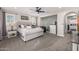 Bright and airy main bedroom with a large bed, side tables, and stylish decor at 20866 W Werner Pl, Buckeye, AZ 85396