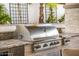Built-in stainless steel outdoor grill with granite countertop, perfect for entertaining and outdoor cooking at 20866 W Werner Pl, Buckeye, AZ 85396