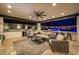Luxurious outdoor kitchen and living space overlooking a stunning pool with fire features at 20866 W Werner Pl, Buckeye, AZ 85396