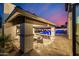Stylish outdoor space featuring an outdoor bar, pool and lounge area, perfect for entertaining at 20866 W Werner Pl, Buckeye, AZ 85396