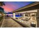 Expansive outdoor living area with a pool, bar seating, kitchen and dining space at 20866 W Werner Pl, Buckeye, AZ 85396