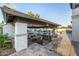 Inviting poolside patio with bar seating, cozy lounge area, and outdoor kitchen features at 20866 W Werner Pl, Buckeye, AZ 85396