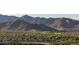 Picturesque view of the community nestled against the backdrop of rugged mountains at 20866 W Werner Pl, Buckeye, AZ 85396