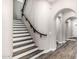 Elegant staircase with wood and white accents, leading to the upper level at 20866 W Werner Pl, Buckeye, AZ 85396