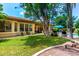 Enjoy this backyard with lush green grass, seating, and mature landscaping at 21353 S 185Th Way, Queen Creek, AZ 85142