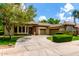 Charming one-story home showcasing a well-manicured lawn, mature trees, and a circular driveway leading to a 3-car garage at 21353 S 185Th Way, Queen Creek, AZ 85142