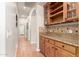Hallway with built in cabinets and granite countertop at 21353 S 185Th Way, Queen Creek, AZ 85142