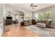 Spacious living room with fireplace, comfortable seating, and lots of natural light at 21353 S 185Th Way, Queen Creek, AZ 85142