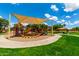 Community playground with a colorful playset, shade cover, and picnic area at 21353 S 185Th Way, Queen Creek, AZ 85142