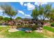 Sossaman Estates water feature with waterfalls and lush landscaping at 21353 S 185Th Way, Queen Creek, AZ 85142