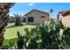 This home features a backyard with a putting green surrounded by desert plants and a pool at 2270 E Indian Wells Dr, Chandler, AZ 85249