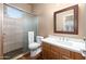 Bathroom with a glass enclosed shower, a toilet, and a wood cabinet vanity at 2270 E Indian Wells Dr, Chandler, AZ 85249
