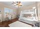 bedroom with wood-look floors, a window, and a bunk bed at 2270 E Indian Wells Dr, Chandler, AZ 85249