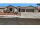 Charming single-story home boasts a three-car garage, well-kept desert landscaping, and a cozy front entryway at 2270 E Indian Wells Dr, Chandler, AZ 85249