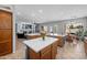 Open-concept kitchen featuring dual islands, stainless appliances, and a view of the living area at 2270 E Indian Wells Dr, Chandler, AZ 85249
