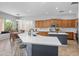 Bright kitchen featuring a large island with a white countertop and a breakfast bar with seating at 2270 E Indian Wells Dr, Chandler, AZ 85249