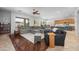 Expansive living room featuring hardwood floors, a comfortable seating area, and a view into the open-concept kitchen at 2270 E Indian Wells Dr, Chandler, AZ 85249