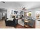 Cozy living room with a fireplace, built-in shelving, comfortable seating, and sliding doors to the outdoor patio at 2270 E Indian Wells Dr, Chandler, AZ 85249