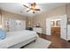Open and airy bedroom featuring a ceiling fan, spacious layout, and access to the ensuite bathroom at 2270 E Indian Wells Dr, Chandler, AZ 85249