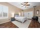 Comfortable bedroom with a ceiling fan, neutral tones, and shuttered windows offering natural light at 2270 E Indian Wells Dr, Chandler, AZ 85249