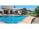 Inviting pool area with comfortable seating, a well-manicured lawn, and lush landscaping for backyard enjoyment at 2270 E Indian Wells Dr, Chandler, AZ 85249