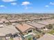 A sweeping aerial shot shows the home nestled in a vast, well-maintained residential community at 22927 E Via Del Oro --, Queen Creek, AZ 85142