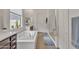 Bright bathroom with a soaking tub, a walk-in shower, and dual vanities at 22927 E Via Del Oro --, Queen Creek, AZ 85142