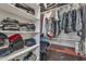 Walk-in closet with neatly arranged shelves and hanging clothes for storage at 22927 E Via Del Oro --, Queen Creek, AZ 85142