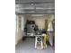 Epoxy-floored garage featuring windows, a workbench, and efficient lighting, ideal for projects at 22927 E Via Del Oro --, Queen Creek, AZ 85142