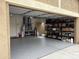 Garage with epoxy flooring offers secure parking with storage shelves for organization at 22927 E Via Del Oro --, Queen Creek, AZ 85142