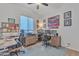 Bright home office featuring dual desk setup, ceiling fan, and personalized decor at 22927 E Via Del Oro --, Queen Creek, AZ 85142