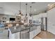 Spacious kitchen with large island, stainless steel appliances, open to living room at 22927 E Via Del Oro --, Queen Creek, AZ 85142