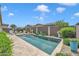 Inviting pool featuring lounge chairs and lush landscaping against a blue sky at 22927 E Via Del Oro --, Queen Creek, AZ 85142