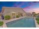 Private backyard oasis showcasing a sparkling pool and patio area perfect for entertaining, with an outdoor dining area at 22927 E Via Del Oro --, Queen Creek, AZ 85142