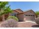 Charming single-story home with well-maintained landscaping and a two-car garage at 22963 W La Pasada Blvd, Buckeye, AZ 85326