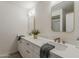 Bathroom with double sinks, white marble countertop, framed mirrors and modern fixtures at 2307 W Nido Ave, Mesa, AZ 85202