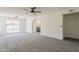 Bright bedroom with an ensuite bathroom and carpeted floors for comfortable living at 2307 W Nido Ave, Mesa, AZ 85202