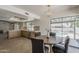 Open floorplan with kitchen and dining area, with backyard access and views at 2307 W Nido Ave, Mesa, AZ 85202