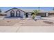 Charming single-story home with desert landscaping and a welcoming arched entryway at 2307 W Nido Ave, Mesa, AZ 85202