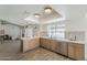 Bright kitchen features stainless appliances, a breakfast bar, and an open design with a view of the backyard pool at 2307 W Nido Ave, Mesa, AZ 85202