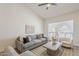 Spacious living area with a large window providing natural light and a comfortable seating arrangement at 2307 W Nido Ave, Mesa, AZ 85202