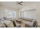 Bright living room showing neutral color palette and updated flooring with natural light at 2307 W Nido Ave, Mesa, AZ 85202