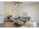 Bright living room boasting vaulted ceilings, modern furnishings, and wood-look tile floors at 2307 W Nido Ave, Mesa, AZ 85202