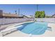 Backyard pool and diving board, surrounded by desert landscaping, with privacy fence at 2307 W Nido Ave, Mesa, AZ 85202
