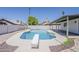 Inviting backyard pool with diving board and surrounding patio, ideal for summer fun and relaxation at 2307 W Nido Ave, Mesa, AZ 85202